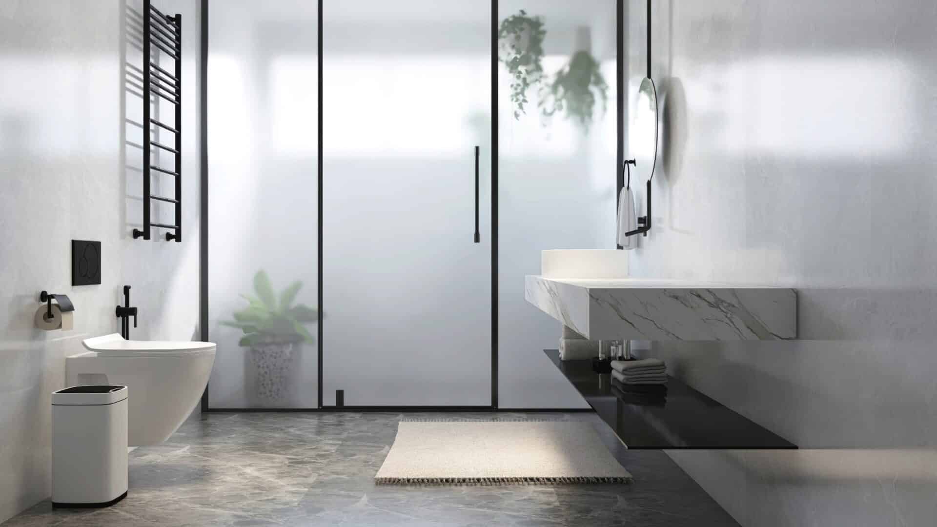 A Homeowner's Guide to Privacy Glass 4 - Angelo and Sons Modern, luxury bathroom with marble vanity counter, white washbasin, round mirror, glass partition to shower enclosure, toilet, gray wall for interior design, toiletries product background 3D