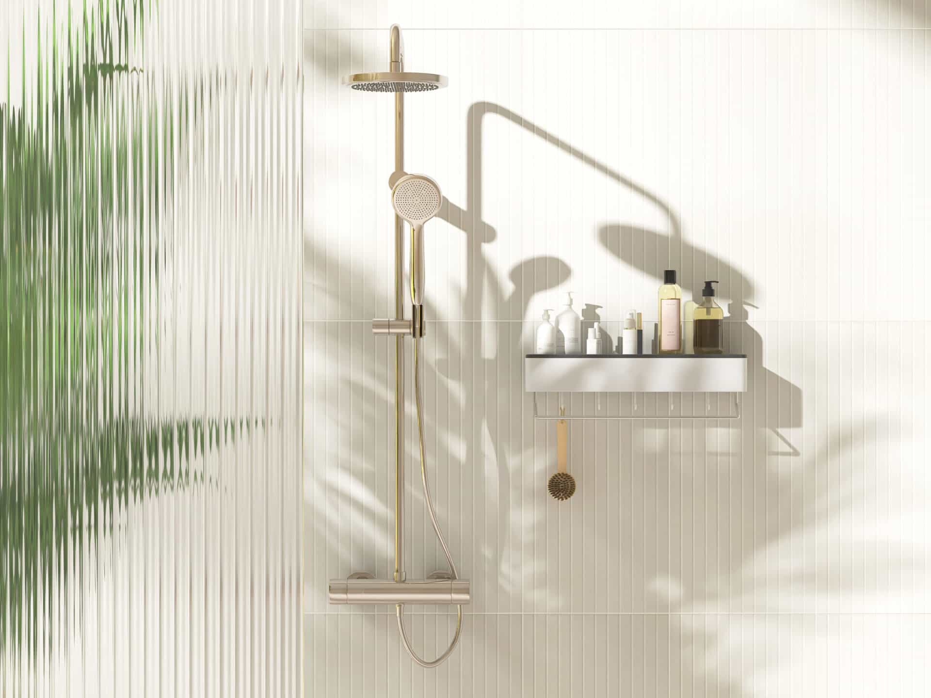A Homeowner's Guide to Privacy Glass 6 - Angelo and Sons Gold rain shower, adjustable shower head, green palm tree, reeded fluted glass partition in sunlight on cream wall bathroom for modern, elegant interior design decoration, product background 3D